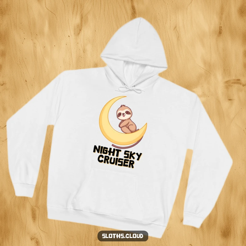 Funny hoodie with a sloth gently riding a crescent moon like a slow roller coaster, offering cozy comfort and cosmic humor.